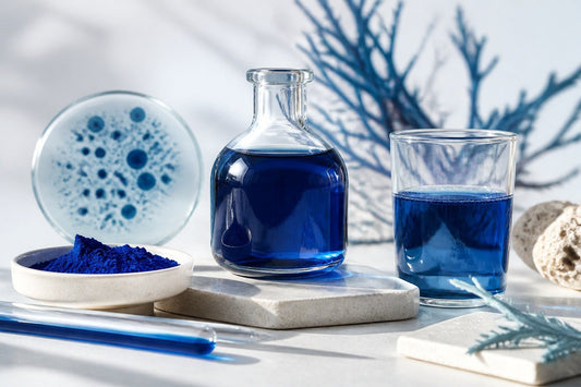 Premium blue Spirulina extract in a glass vessel with intense natural blue colour and clean science-editorial lighting